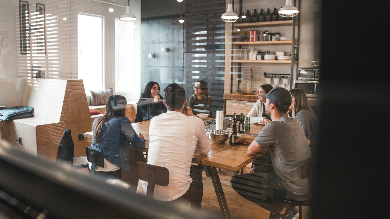 Small team reviewing work together in a bright meeting room